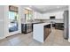 Bright kitchen with stainless steel appliances and an island with sleek countertops at 2405 W Memorial Dr, Anthem, AZ 85086