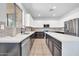 Spacious kitchen featuring white cabinets, granite counters, and stainless steel appliances at 2405 W Memorial Dr, Anthem, AZ 85086