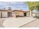 View of the backyard with a covered patio and desert landscaping at 2605 E Fountain St, Mesa, AZ 85213