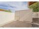 View of storage shed and block fence in backyard at 2605 E Fountain St, Mesa, AZ 85213