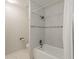 Bathroom featuring a bathtub with tiled walls, shower, and neutral decor at 2605 E Fountain St, Mesa, AZ 85213