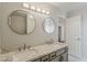 Well-lit bathroom with dual sinks, marble countertops, and a modern aesthetic at 2605 E Fountain St, Mesa, AZ 85213