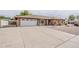 Charming single-story brick home with a spacious driveway and two-car garage at 2605 E Fountain St, Mesa, AZ 85213