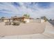 Well-kept single-Gathering home featuring low maintenance desert landscaping, a fenced yard, and an attached garage at 2605 E Fountain St, Mesa, AZ 85213