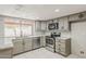 Beautifully updated kitchen featuring stainless steel appliances and granite countertops at 2605 E Fountain St, Mesa, AZ 85213