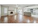Spacious living room with hardwood floors, fireplace, and abundant natural light at 2605 E Fountain St, Mesa, AZ 85213