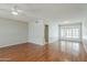 Living room with hardwood floors, neutral paint, and lots of natural light at 2605 E Fountain St, Mesa, AZ 85213