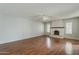 Cozy living room with hardwood floors and a classic fireplace feature at 2605 E Fountain St, Mesa, AZ 85213