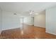 An expansive living room featuring hardwood floors and a ceiling fan at 2605 E Fountain St, Mesa, AZ 85213