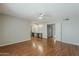 Spacious main bedroom featuring hardwood floors, ceiling fan, a dual vanity, and separate closets at 2605 E Fountain St, Mesa, AZ 85213