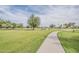 Community park featuring expansive green space, walking path, and a picnic area for outdoor recreation at 2605 E Fountain St, Mesa, AZ 85213