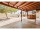 Covered patio with concrete flooring overlooking a large backyard with block fencing at 2605 E Fountain St, Mesa, AZ 85213