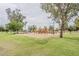 Community playground with swings, slides, and climbing structures, perfect for families to enjoy outdoor activities at 2605 E Fountain St, Mesa, AZ 85213