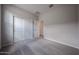 Bedroom with sliding closet doors and carpet flooring at 2614 E Music Mountain Ave, Apache Junction, AZ 85119