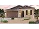 Charming single-story home featuring a two-car garage and desert landscaping at 2614 E Music Mountain Ave, Apache Junction, AZ 85119
