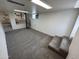 Spacious basement with neutral carpet, white walls, and unique spiral staircase at 3062 N 42Nd Ave, Phoenix, AZ 85019
