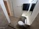 Bright bathroom featuring neutral tile floor, toilet, sink, and decorative mirror at 3062 N 42Nd Ave, Phoenix, AZ 85019