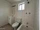Bright bathroom with white tile, vanity, and a window for natural light provides a calming space at 3062 N 42Nd Ave, Phoenix, AZ 85019