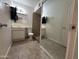 Bathroom features neutral tile floors and a sink, toilet, and shower at 3062 N 42Nd Ave, Phoenix, AZ 85019