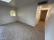 An airy bedroom featuring a tile floor, arched window, and natural lighting at 3062 N 42Nd Ave, Phoenix, AZ 85019