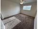 Spacious bedroom with ceiling fan, carpeted floors, and large window at 3062 N 42Nd Ave, Phoenix, AZ 85019