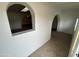 Welcoming interior entryway with tile flooring and arched openings, creating a unique architectural design at 3062 N 42Nd Ave, Phoenix, AZ 85019