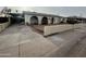 View of the home with unique arched entryways, desert landscaping, and a covered parking area at 3062 N 42Nd Ave, Phoenix, AZ 85019