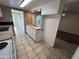 Bright kitchen featuring ample counter space, white cabinetry, and tiled flooring at 3062 N 42Nd Ave, Phoenix, AZ 85019