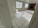 Bright living room featuring tile floors and a brick fireplace at 3062 N 42Nd Ave, Phoenix, AZ 85019
