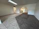 Spacious living room featuring tile and carpet flooring, with arched openings that lead to other rooms at 3062 N 42Nd Ave, Phoenix, AZ 85019
