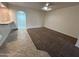 Living area with carpet and tile flooring, opening to the kitchen area at 3062 N 42Nd Ave, Phoenix, AZ 85019