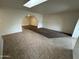 Living room featuring carpet and tile flooring, with an arched doorway leading to other rooms at 3062 N 42Nd Ave, Phoenix, AZ 85019