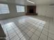 Open living room with bright tile floors and brick fireplace at 3062 N 42Nd Ave, Phoenix, AZ 85019