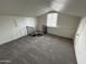 Loft area features a window, neutral carpet, and a railing at 3062 N 42Nd Ave, Phoenix, AZ 85019