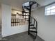 Unique spiral staircase connects the basement to the above kitchen at 3062 N 42Nd Ave, Phoenix, AZ 85019