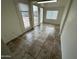A sunroom with tiled flooring, bright lighting and views of the exterior at 3062 N 42Nd Ave, Phoenix, AZ 85019