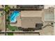 Aerial view showcasing a private backyard with a pool, putting green, and covered patio area at 4323 E Dublin St, Gilbert, AZ 85295