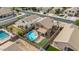 An aerial view of a private backyard featuring a sparkling pool and covered patio at 4323 E Dublin St, Gilbert, AZ 85295
