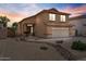 Charming two-story home with a well-manicured front yard with drought resistant landscaping and a two car garage at 4323 E Dublin St, Gilbert, AZ 85295