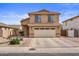 Charming two-story home with a well-manicured front yard with drought resistant landscaping and a two car garage at 4323 E Dublin St, Gilbert, AZ 85295