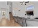 Open-concept living space showcasing a staircase, media center, and comfortable sofa for relaxation at 4323 E Dublin St, Gilbert, AZ 85295