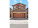 Two-story home features a wide garage door with decorative windows at 4380 E Renee Dr, Phoenix, AZ 85050