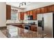Kitchen featuring granite countertops, stainless steel appliances, and wood cabinetry at 4380 E Renee Dr, Phoenix, AZ 85050