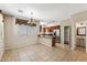 Open kitchen overlooking a dining area with stylish lighting and a view of the half bath at 4380 E Renee Dr, Phoenix, AZ 85050