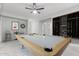 An entertainment game room with a pool table, cue storage and a dart board at 4497 E Carriage Way, Gilbert, AZ 85297