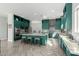 Bright, spacious kitchen boasts a large island, updated appliances, and stylish green cabinetry at 4497 E Carriage Way, Gilbert, AZ 85297