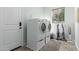 Bright laundry room features a washer and dryer with a window letting in natural light at 4497 E Carriage Way, Gilbert, AZ 85297