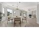 Open-concept living area with a dining space, seamlessly connecting relaxation and dining at 4497 E Carriage Way, Gilbert, AZ 85297