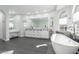 Luxurious main bathroom with double vanity, free-standing tub, and modern fixtures at 4497 E Carriage Way, Gilbert, AZ 85297