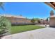 Expansive backyard with artificial turf, patio, and lush landscaping, ideal for outdoor living at 4560 E Paso Trl, Phoenix, AZ 85050